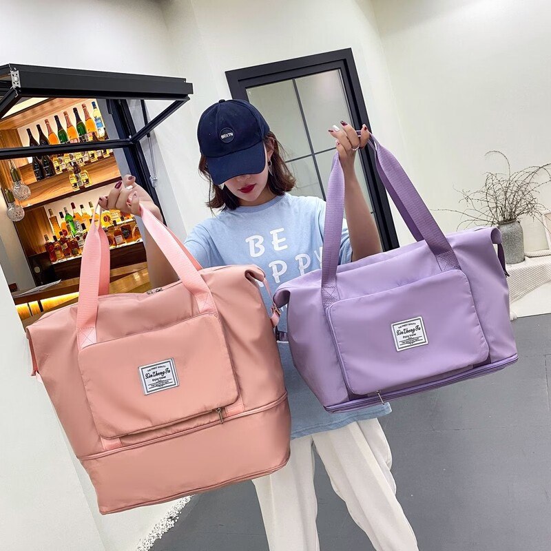 0点39.9元 纪希琳旗舰店高颜值大容量手提旅行包(OfBy2FbTfZ8)/折叠起来就是手包的大小面料防水，出行非常方便